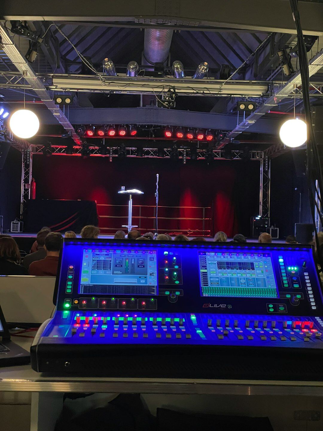 Broadcast control room with live video monitors