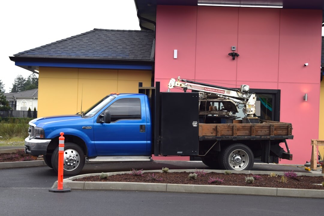 Satellite uplink truck technician adjusting broadcast dish