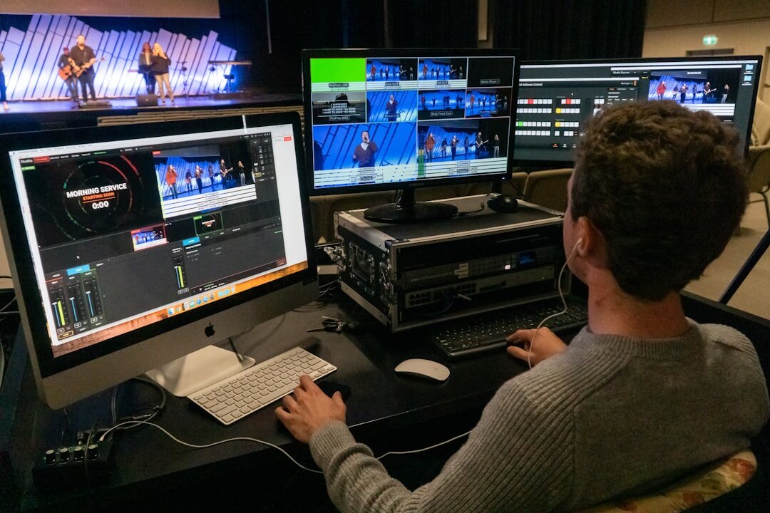 Wall of broadcast monitors displaying multiple live camera feeds