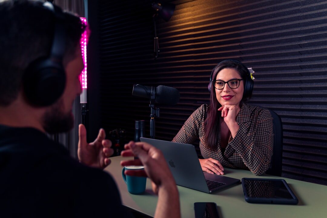 Finnish female journalist interviewing a guest with a boom microphone nearby